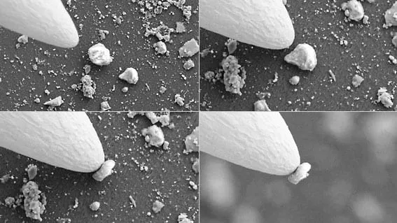 SEM sequence of a fine probe tip picking up a sub-micron particle.